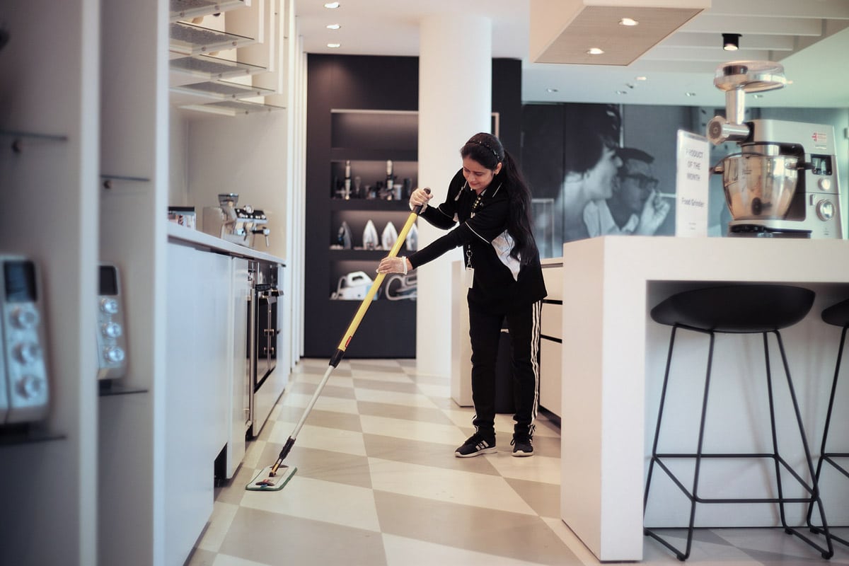 Person moping kitchen